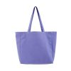 What are the benefits of using a cotton canvas tote bag over other types of tote bags?